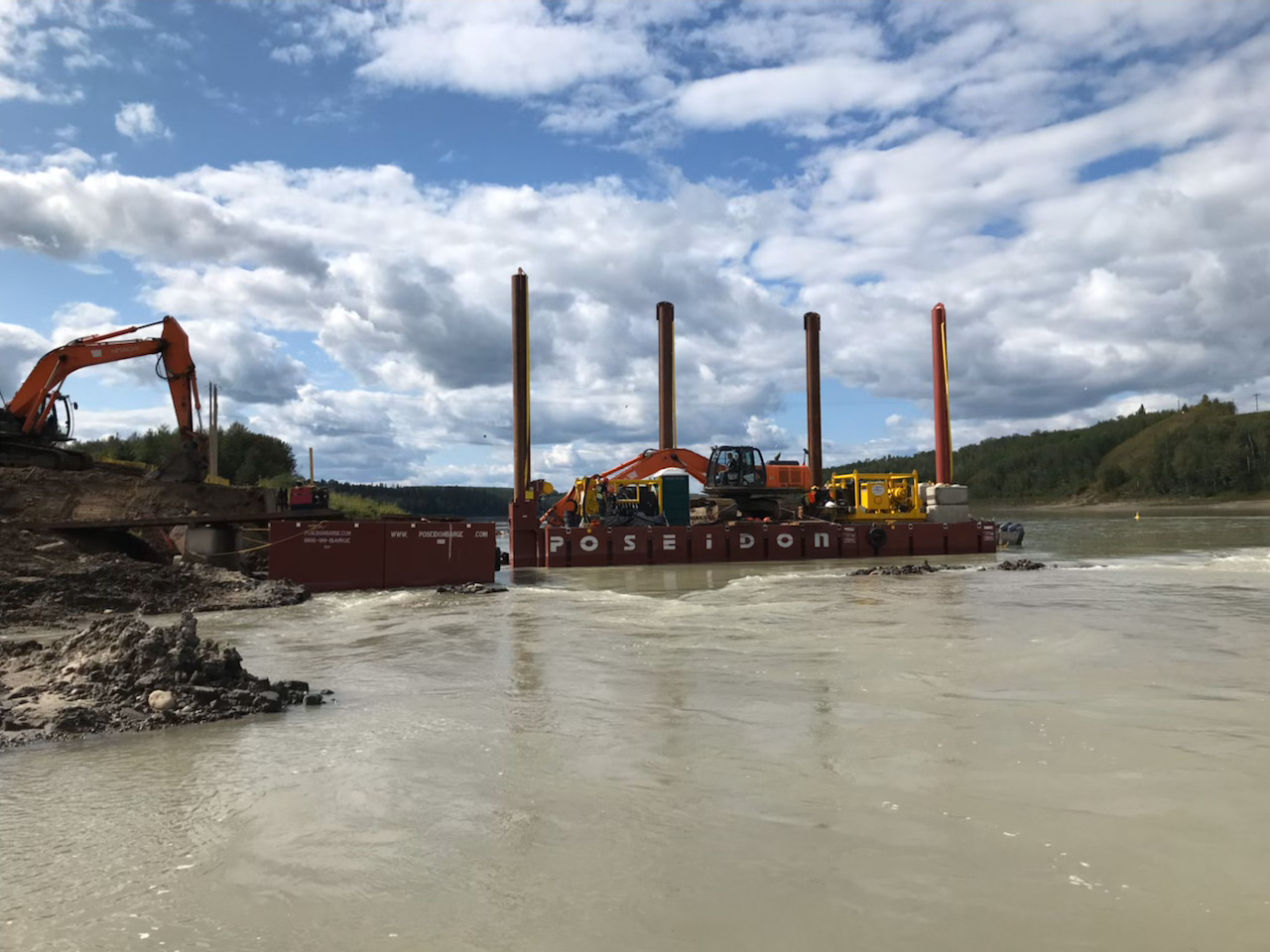 Spud barge for installing a water intake in the Athabasca River