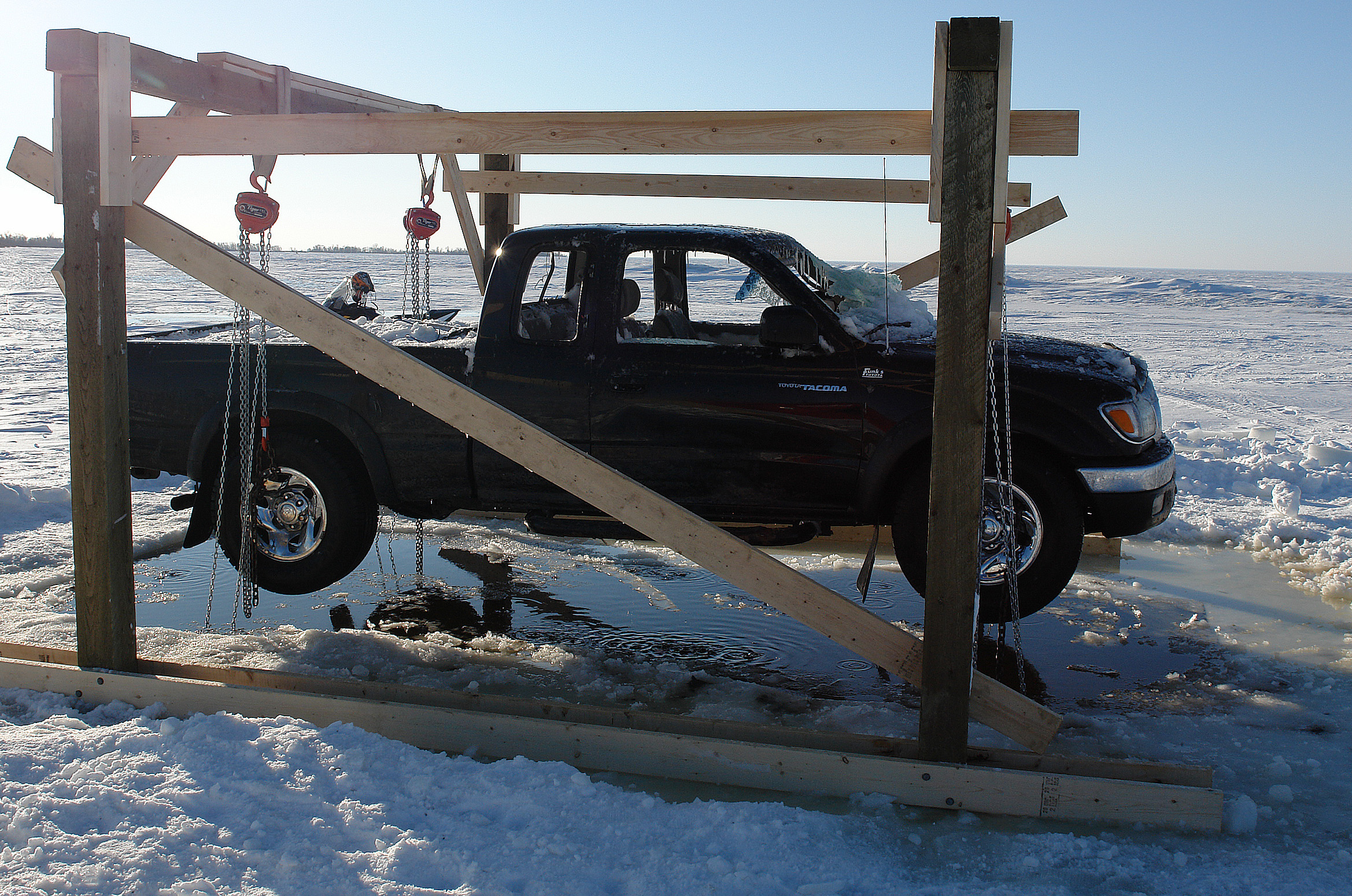 Recovering a vehicle with a lifting frame at a remote site.